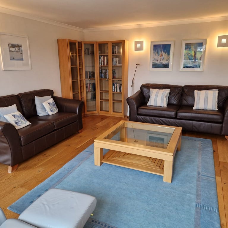 Two Marks and Spencers Abbey brown leather sofas