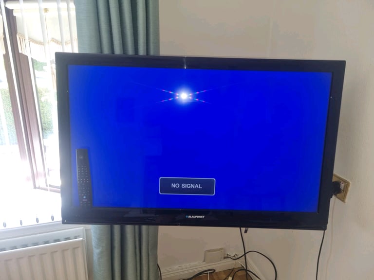 42" TV and remote with adjustable bracket 