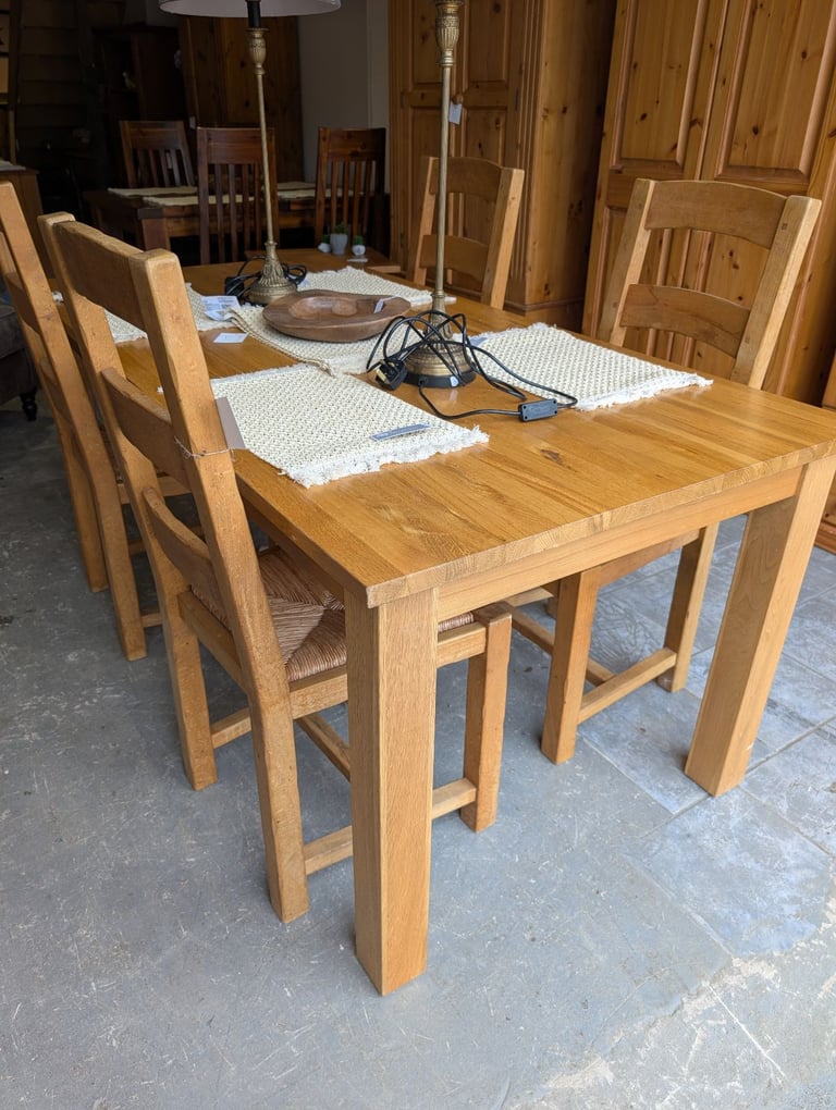 Solid oak dining table and chairs 