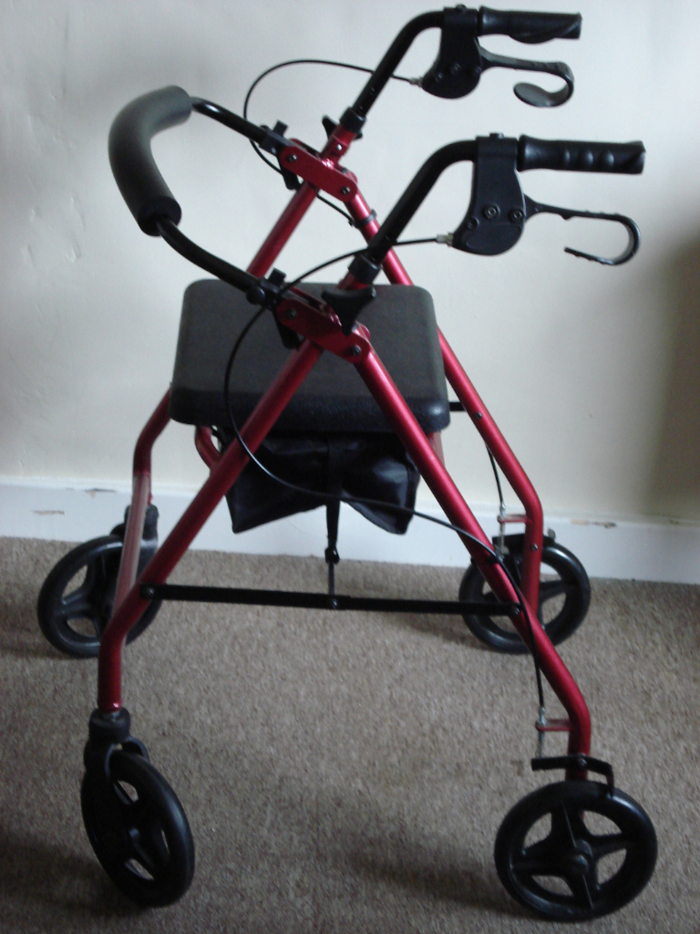 Mobility aid - walker with 4 wheels, brakes, and seat