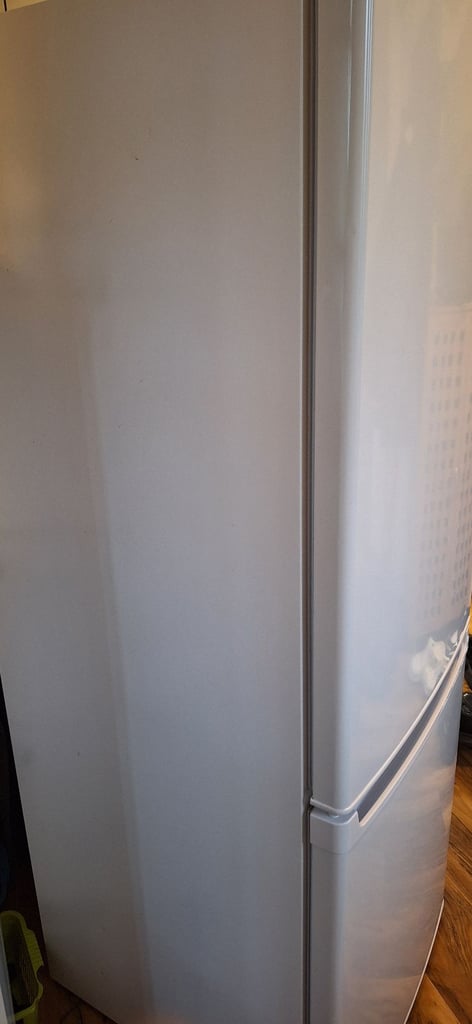 LOGIK fridge freezer size  H 142cm like new one year old 