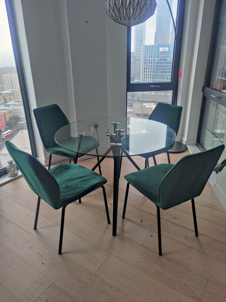 Glass table with four velvet chairs