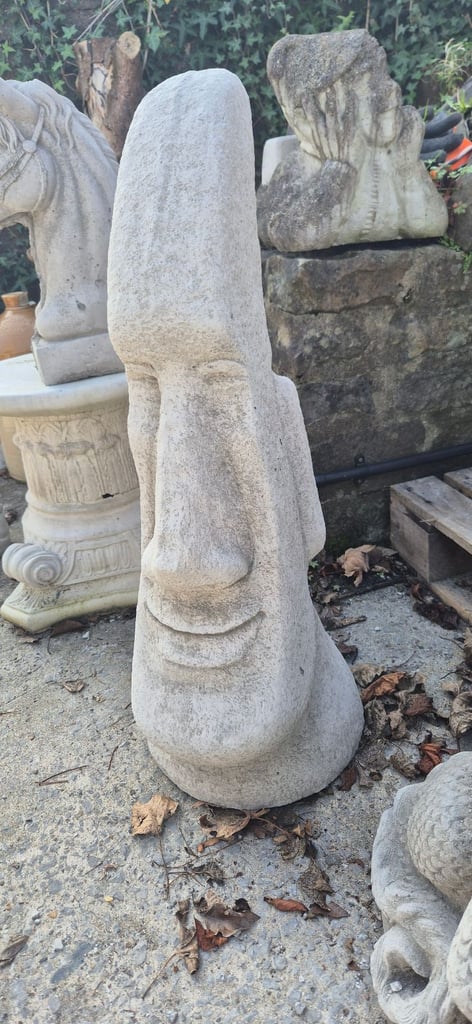 Large concrete Easter island head statues