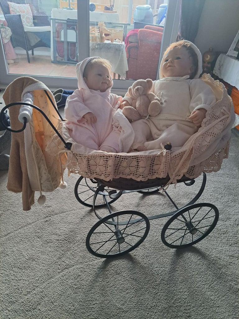 Collectable baby dolls and antique style pram