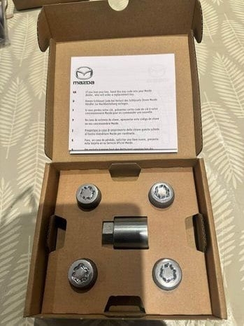BNIB:- Full set of Genuine Mazda Wheel Locking Nuts- any model/year