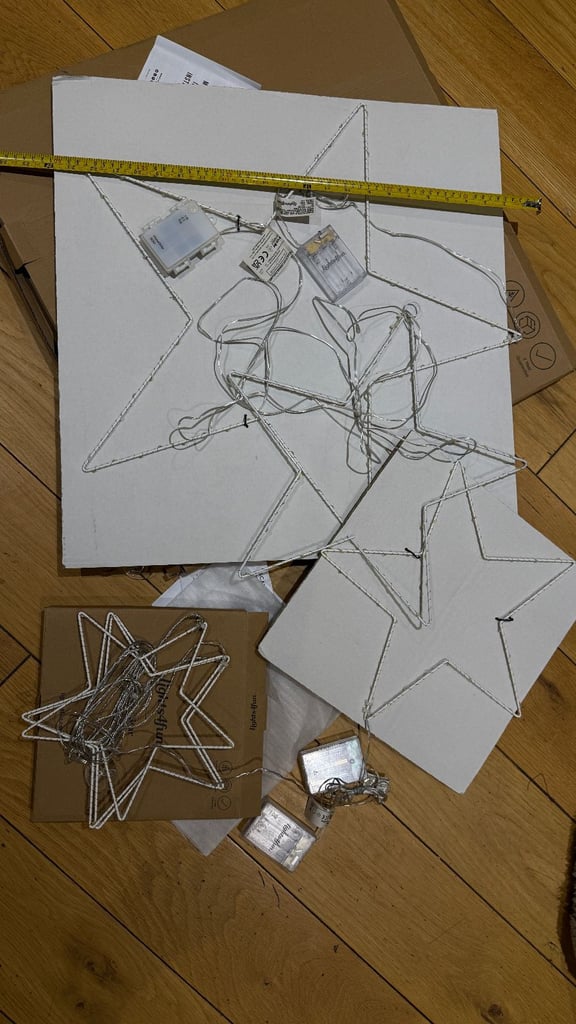 2 sets of Osby Stars Christmas decorations