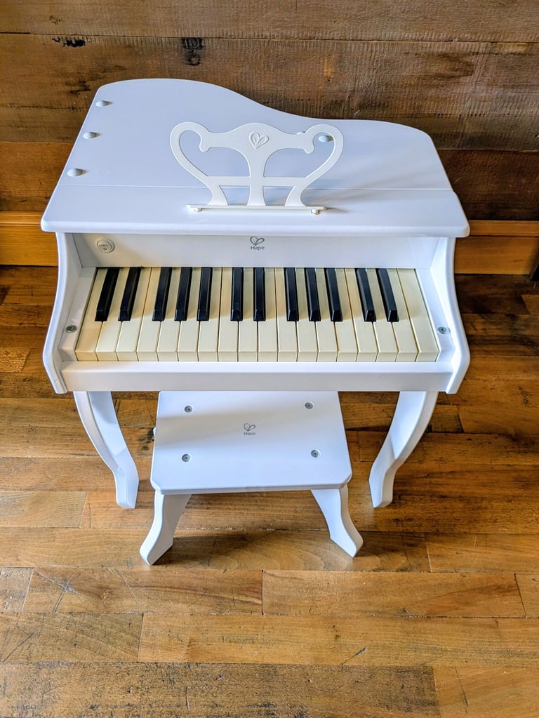 image for Hape white grand piano with stool great condition RRP180