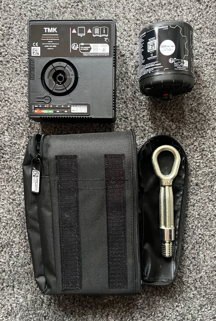 Genuine BMW tyre repair kit and towing eye hook.
