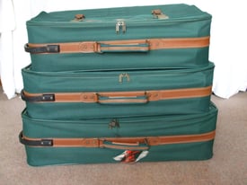 Set of three matching Pierre Cardin wheeled suitcases