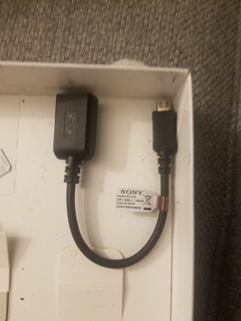 Black sony mobile with charger