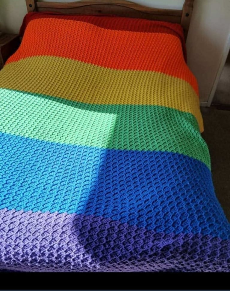 Crocheted king-size.  Rainbow colours Striped blanket