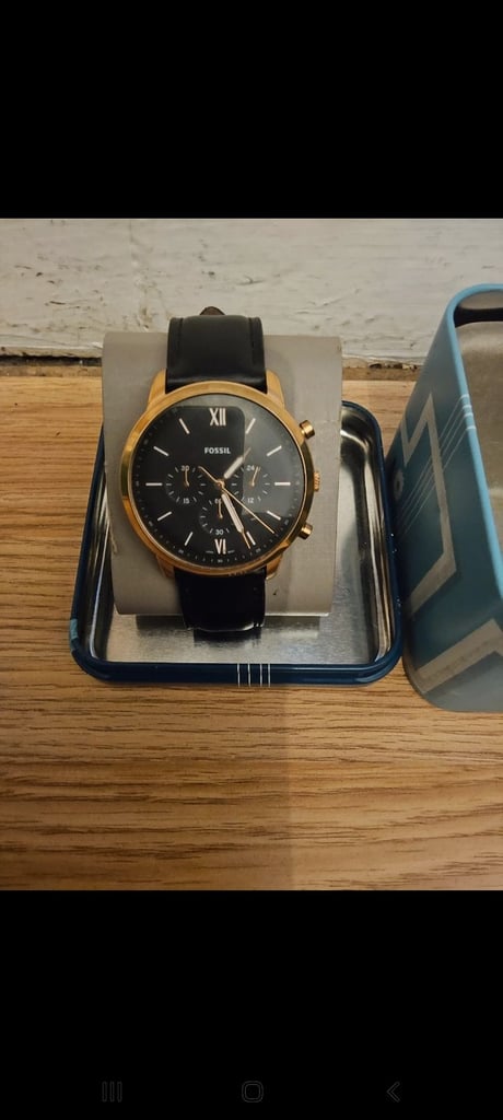 Gold and black fossil watch 