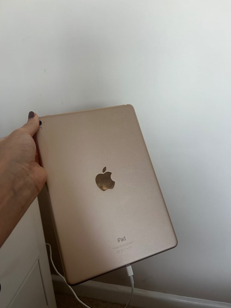 Gold IPad Pro 2016 and charger 