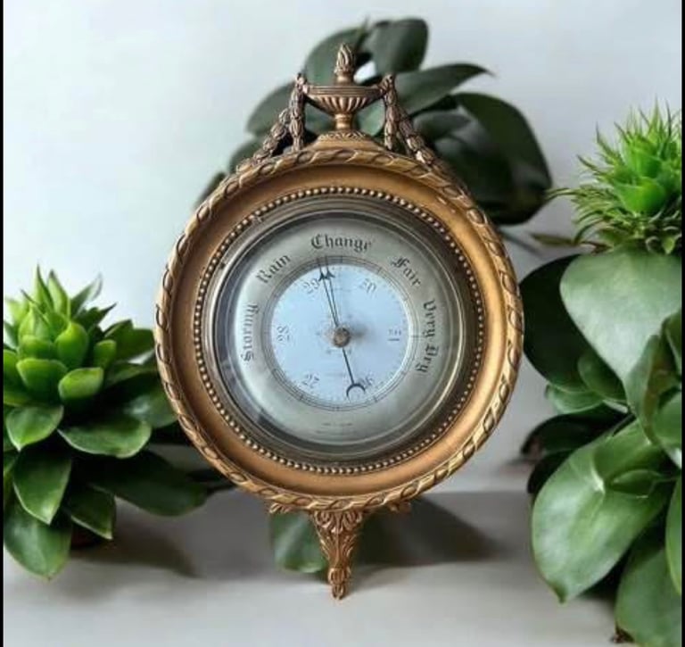 Ornate  Vintage compensated aneroid barometer with silvered dial mounted in an ornate gilt frame.