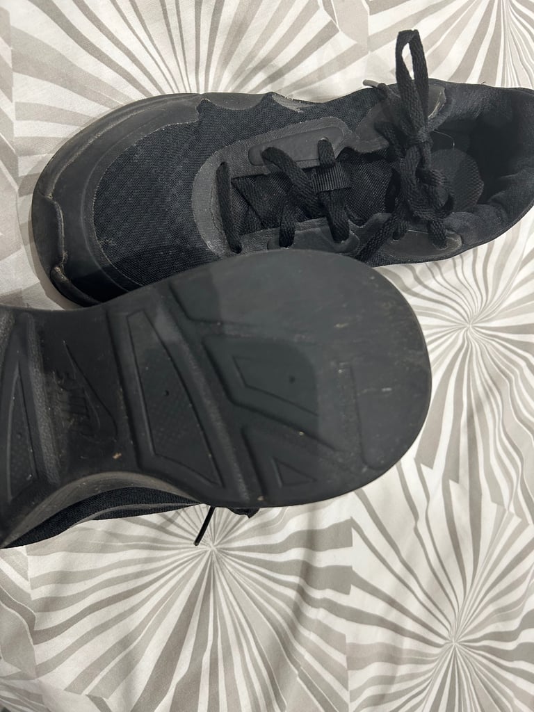 Ladies lace up Nike black trainers. Size 4