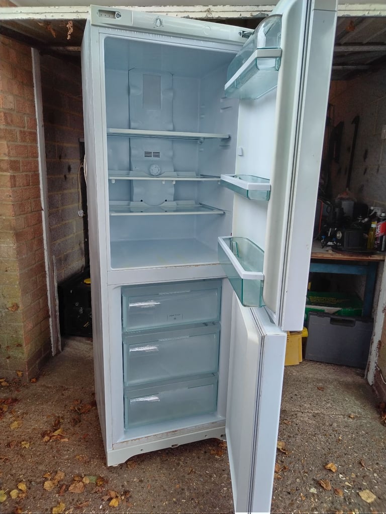 Hotpoint Fridge freezer 5ft x 9 inch high has couple of marks but all working can deliver local 