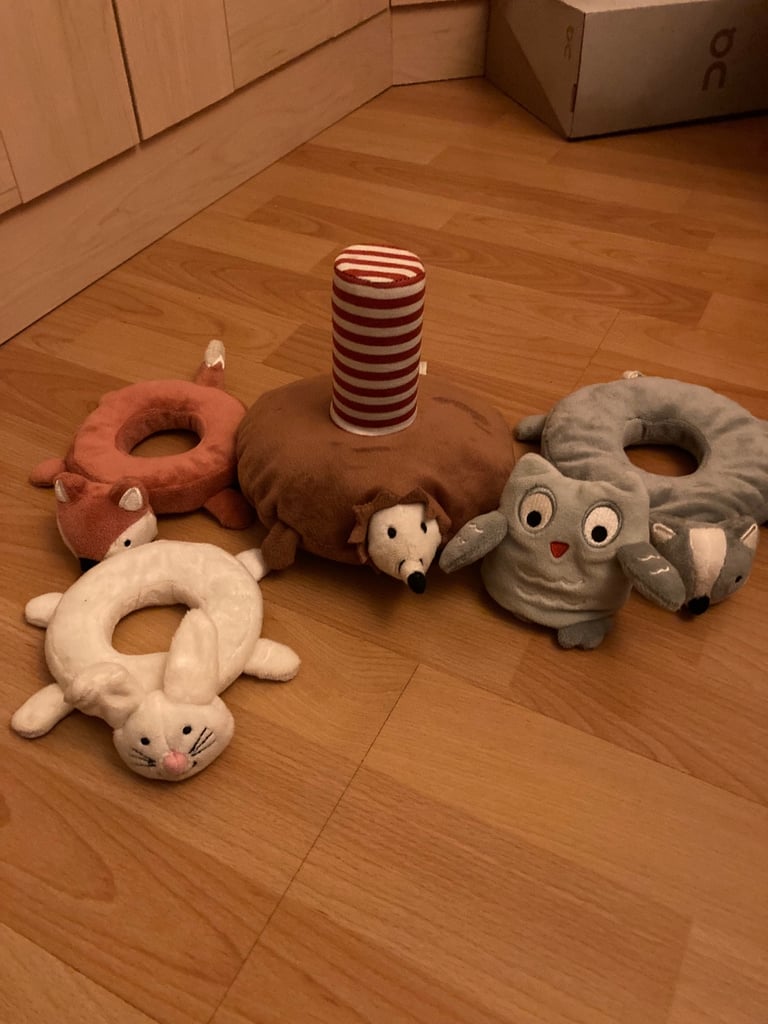 Selection of soft toys inc Peter rabbit bunny, giraffe, Winnie the Pooh and animal stacking ring