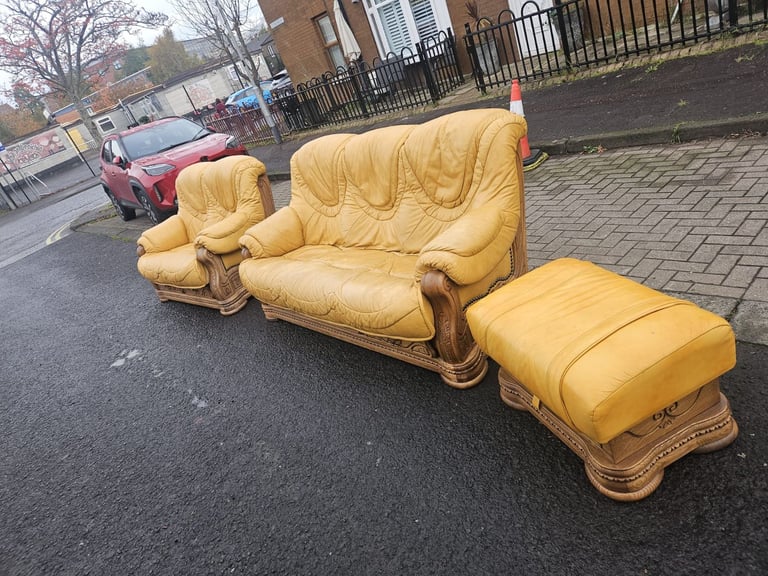 Leather sofa in soild oak inset with matching footstool 