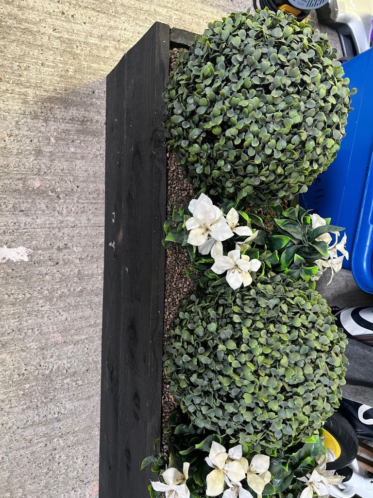Fake plant in planter 