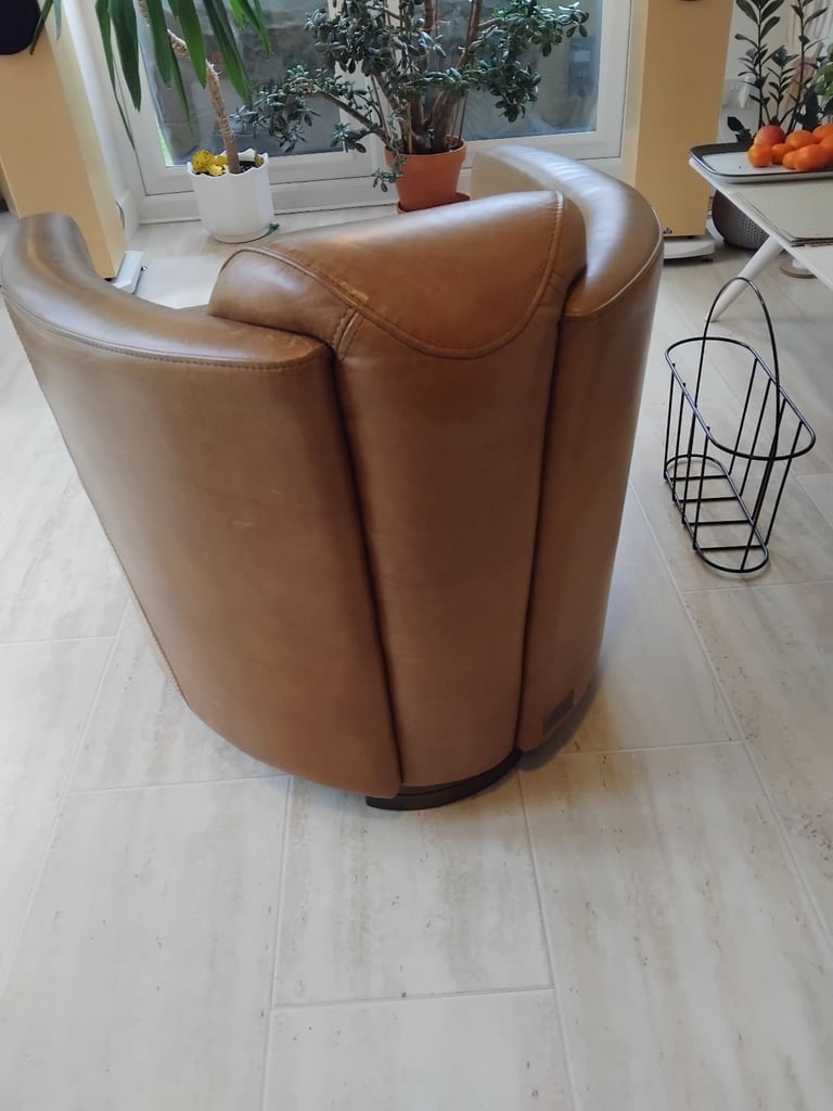 Pair of Halo Rocket/Aviator chairs in Old Saddle Nut leather. Two chairs.