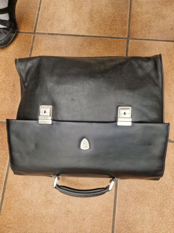 Lamborghini leather bag with pull string bag and luggage tag. Notts. 