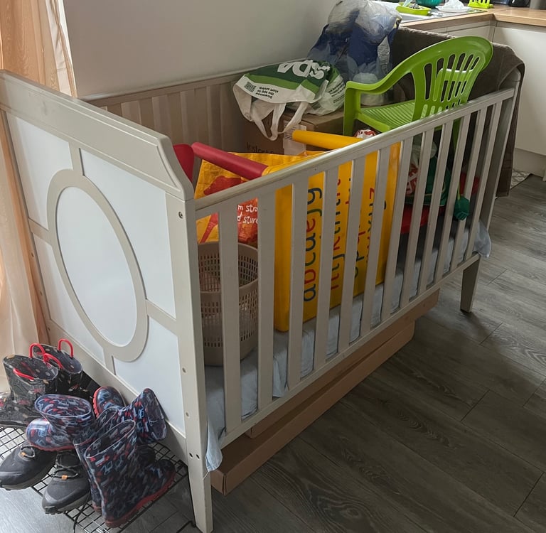 Wooden cot with mattress