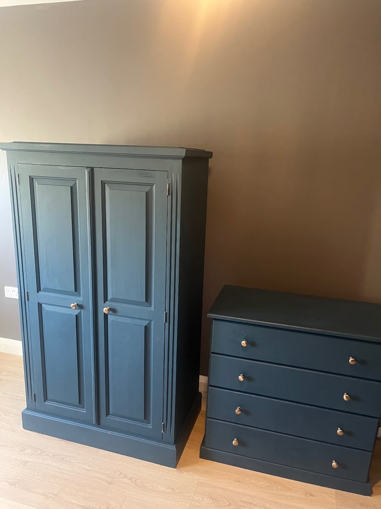 Wardrobe and drawers set navy blue , chunky wood gold knobs . 