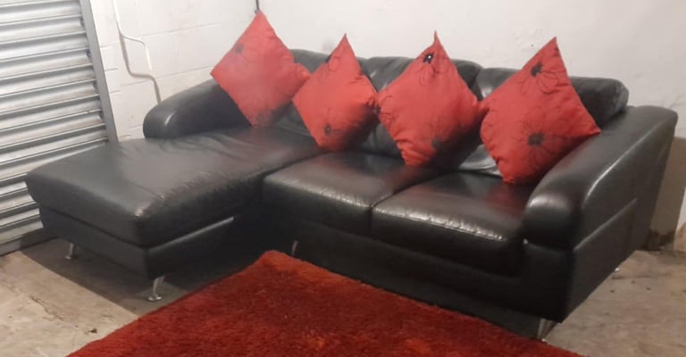 image for Black real leather corner chaise sofa from Furniture Village very stylish and modern design