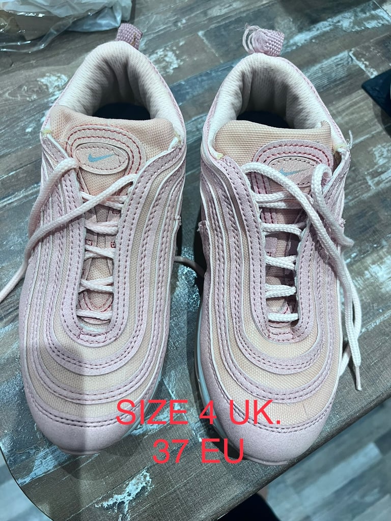 blush colored nike shoes