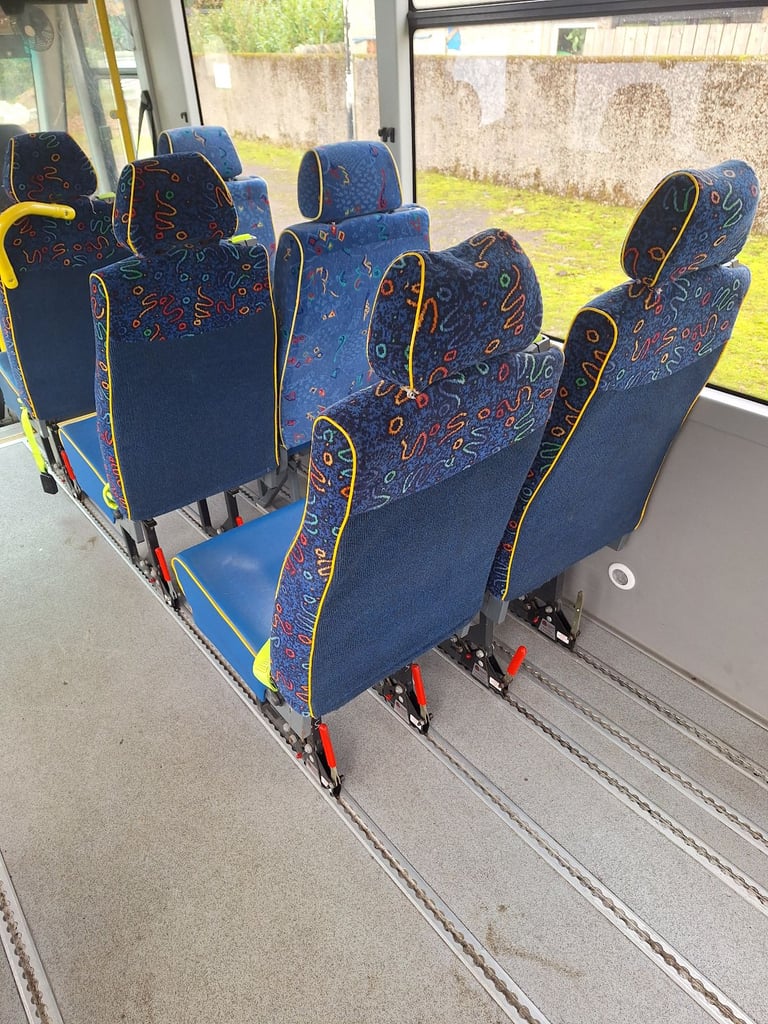 Quick release minibus seats with seatbelts