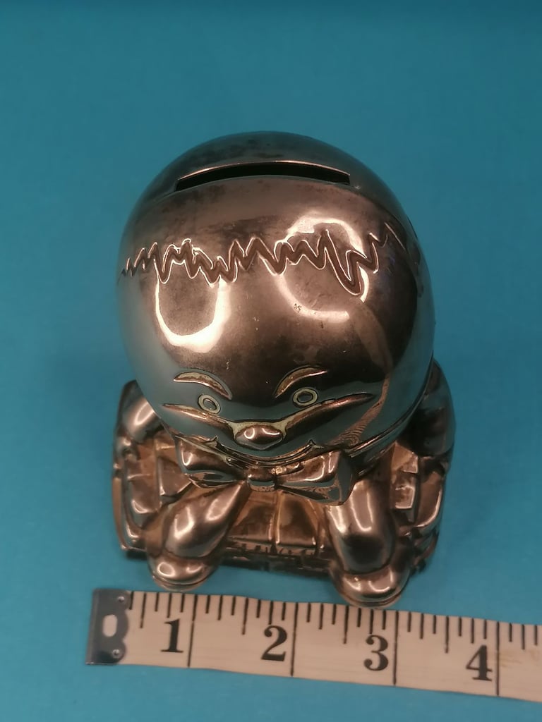 Vintage Humpty Dumpty Silver Plated Metal Coin Bank Money Box.. Missing one part.