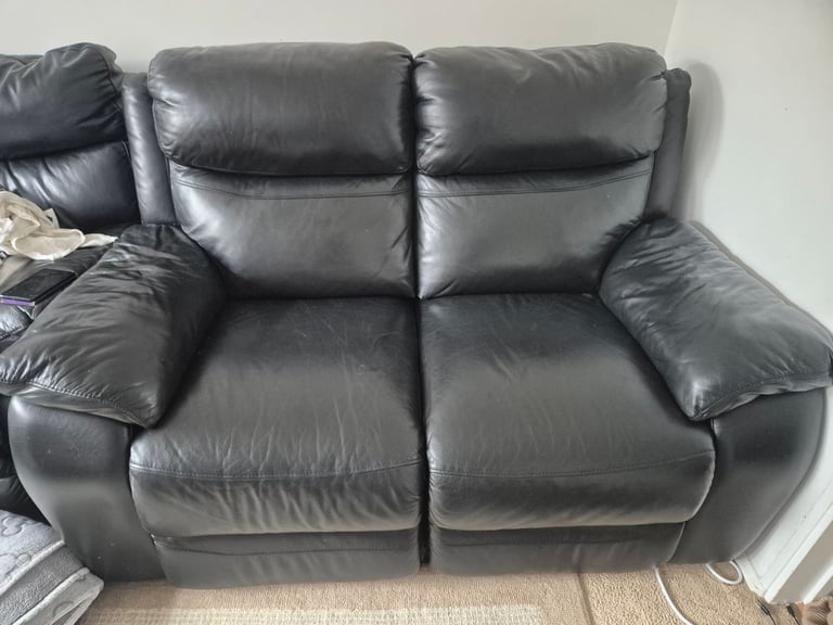 Two seater leather reclining sofa