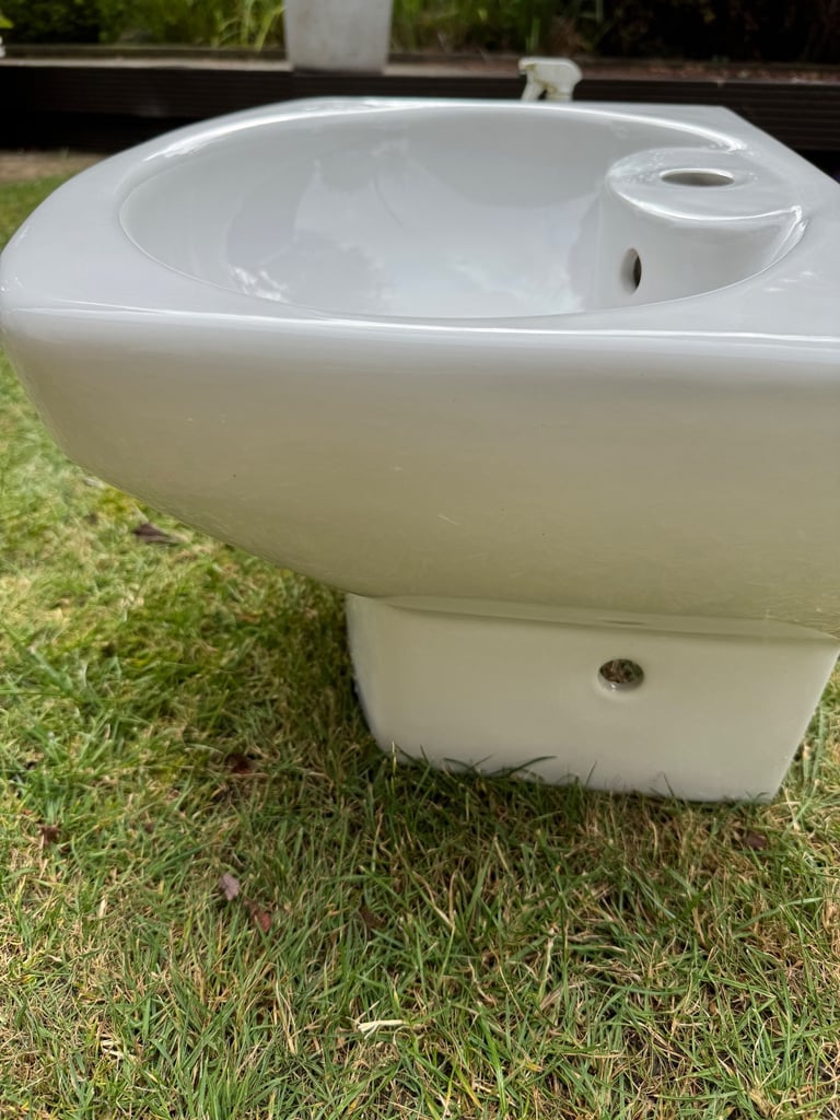 Roca brand white ceramic wall hanging cloakroom sink.  