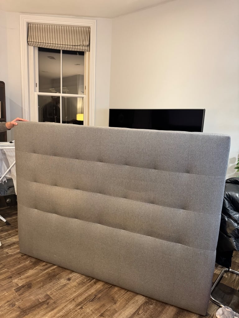 Grey upholstered bed headboard