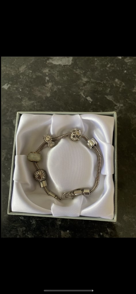 Pandora style bracelet with 5 charms comes in box 18cm long very nice gift accept 