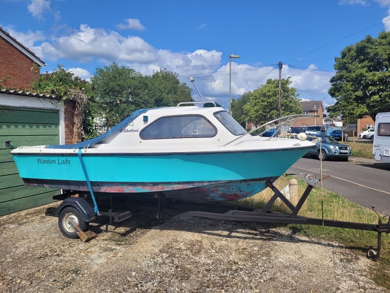 Shetland 460 cabin boat and road trailer.