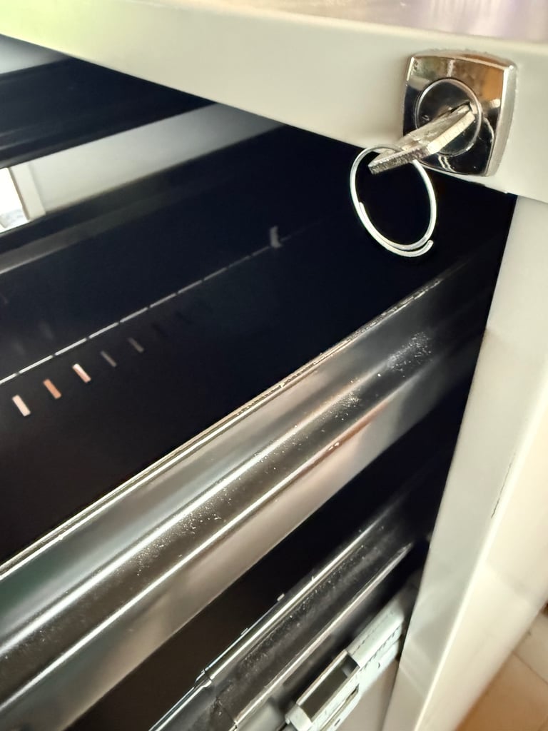 Grey Metal Four Drawer Filing Cabinet