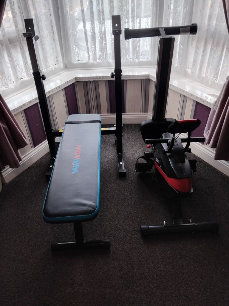 Rowing machine and weights bench