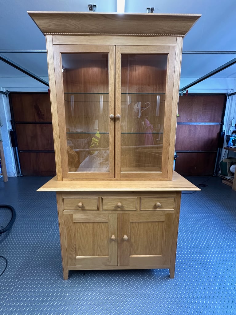 Oak two piece display/storage cabinet with lights.