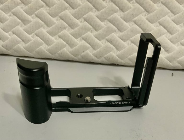 Grip for Olympus E-M5ii mirrorless camera.
