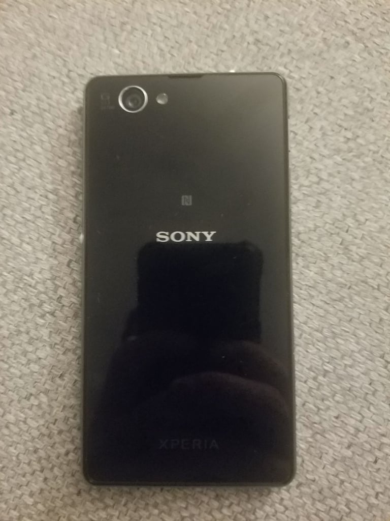 Black sony mobile with charger
