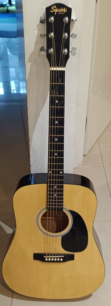 image for Light brown guitar with black case 
