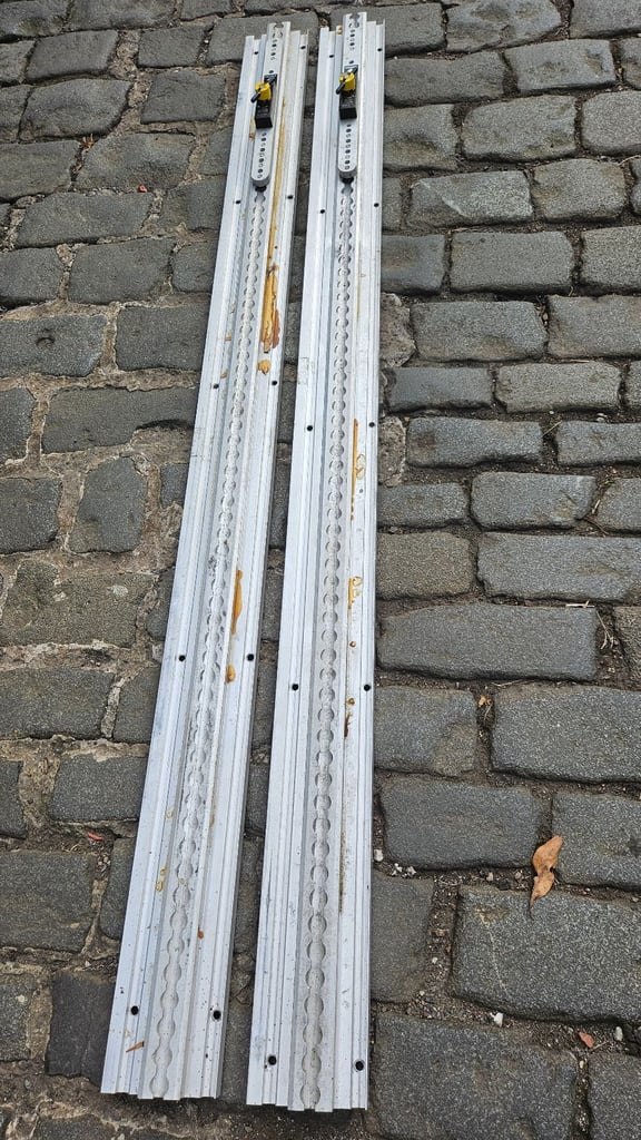 2 Unwin heavy duty floor rail tracks with clamps and end pieces.