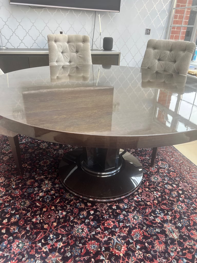 Luxury wooden dining table and velvet chairs 