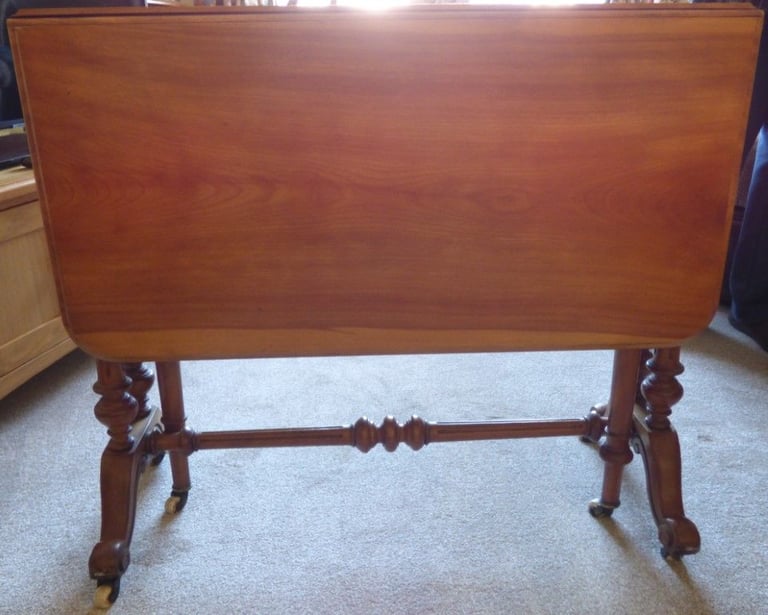 image for Original old Sutherland table. Original casters on feet.