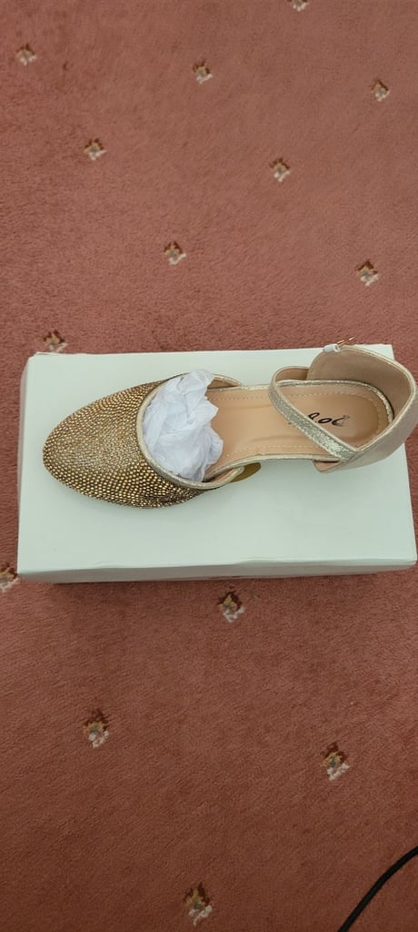 Girls gold heel sandals.