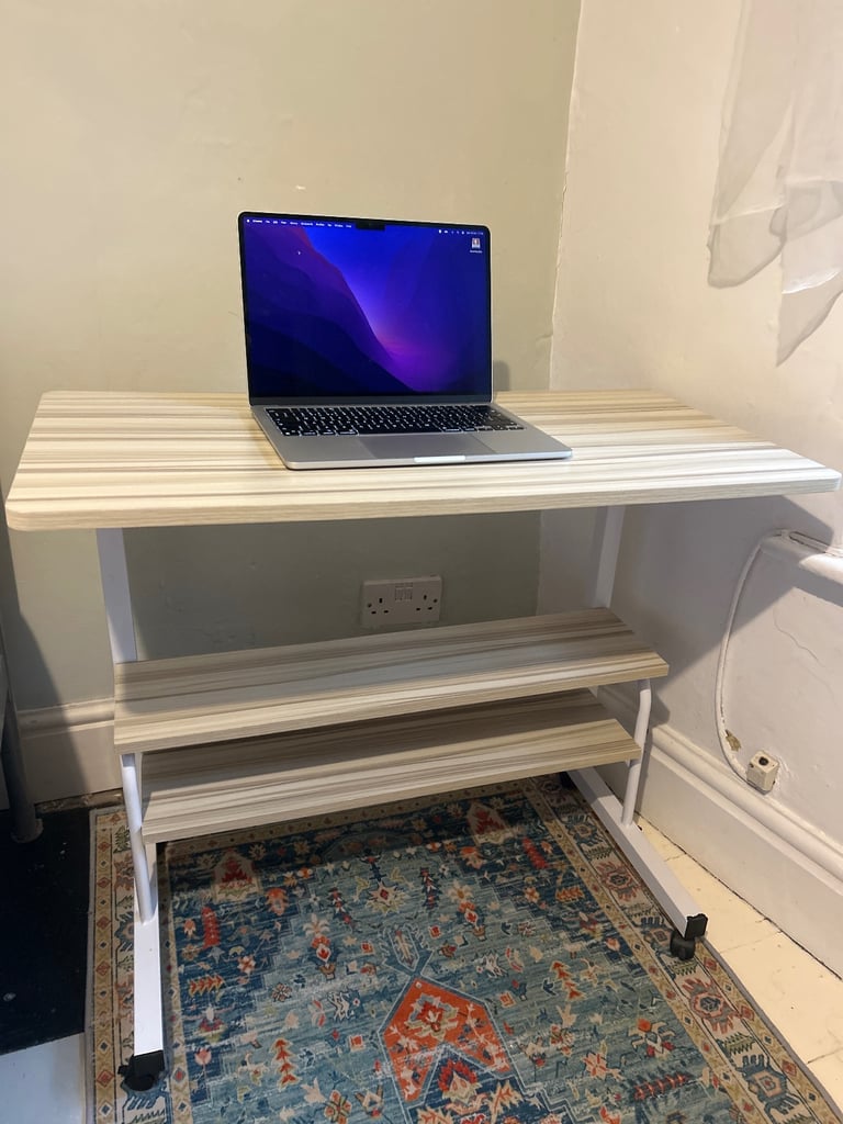 Adjustable height desk with wheels and shelves