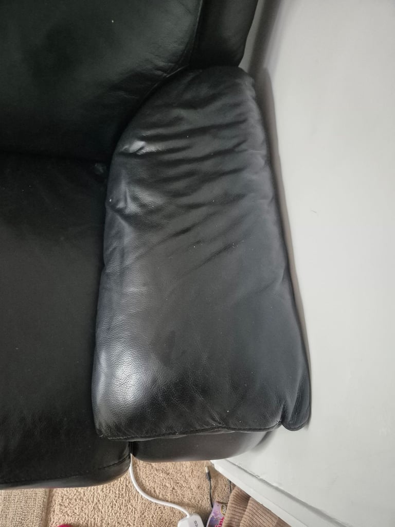 Two seater leather reclining sofa