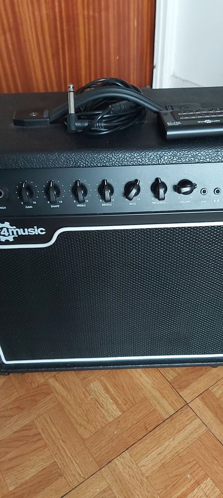 Chicago bass guitar & 15w amp, strap, stand, tuner and padded bag.