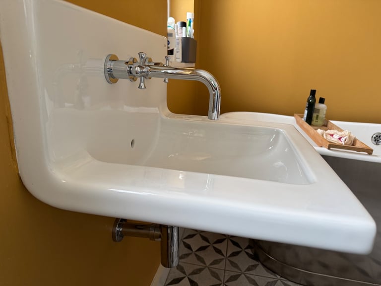 Roca wall mounted sink with back splash